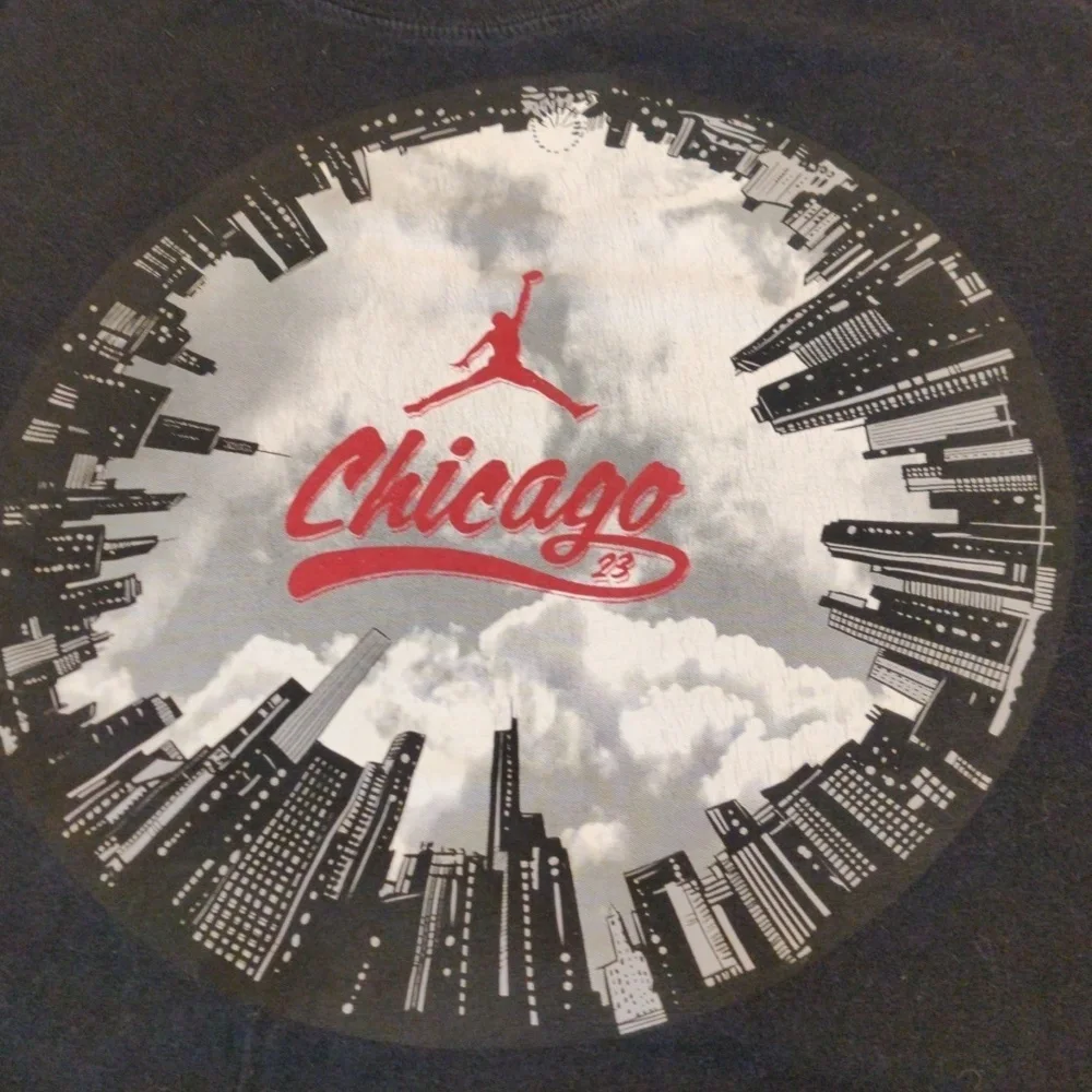 Jordan shirt with Chicago displayed in the middle